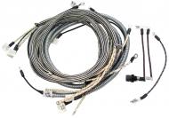 WIRING HARNESS 
 CLOTH COVERED LIKE ORIGINAL INCLUDES WIRING INSTRUCTIONS & LIGHT WIRES 
 USA MADE 
 International Applications: M W/ REGULATOR ON STEERING POST (UNDER FUEL TANK) (SN FBK 229911 & UP), EARLY SUPER M (SN F501 - F28174 AND SN L500001 - L504801 GAS) WITH BATTERY BOX UNDER FUEL TANK