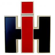 PLASTIC IH EMBLEM (FOR FRONT OR FOR CAB) 
 WHITE PLASTIC W/PAINTED RED 'I' AND BLACK 'H'. 2 MOUNTING HOLES ON BACKSIDE. 4" TALL & 3-5/8" WIDE 
 International Applications: FRONT EMBLEM: 544, 656, 664, 706, CAB EMBLEM: 4100, 4156, 4166, 4186, 4366, 4386 
 Replacement Part #: 2751848R1